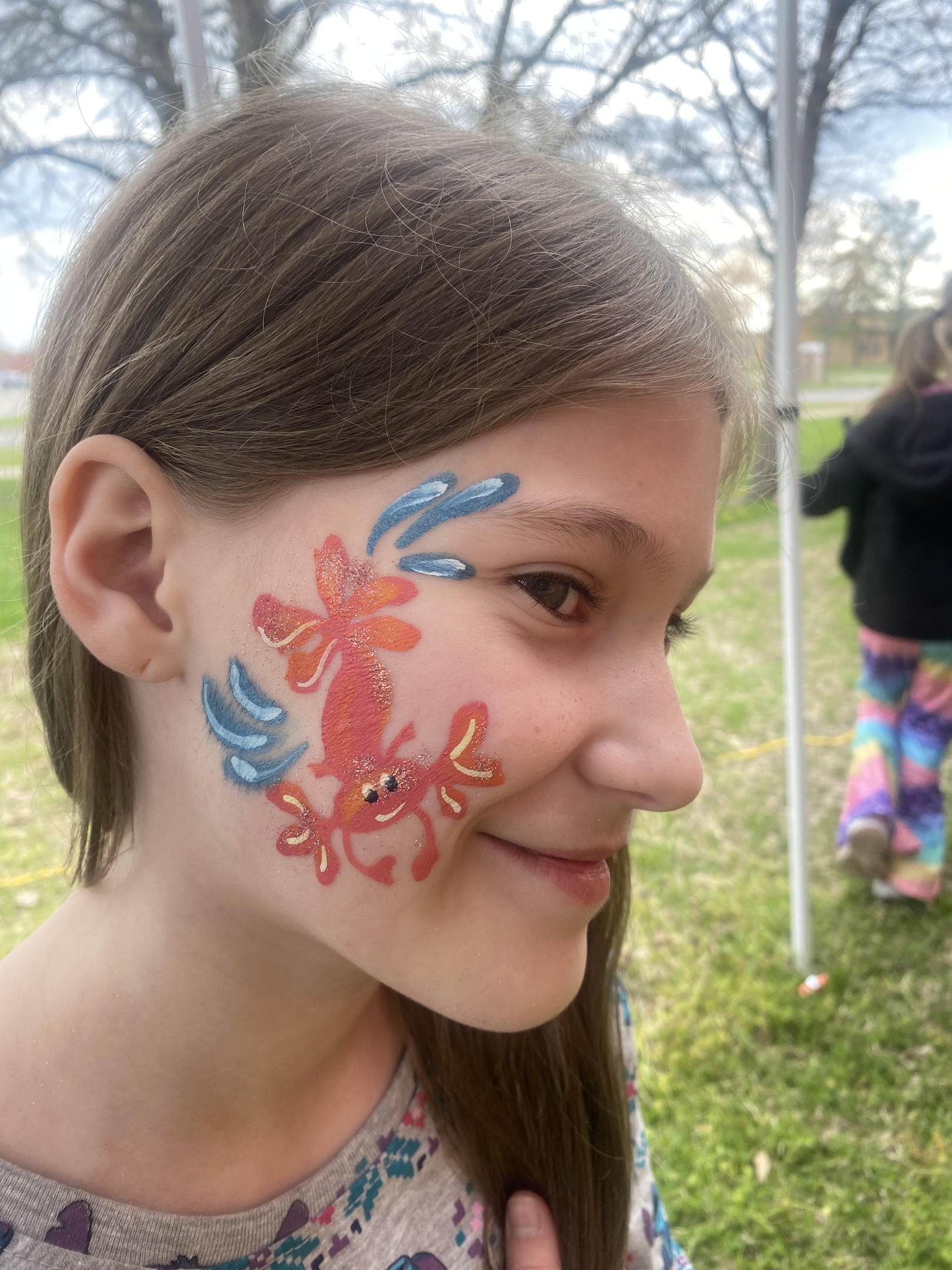 Crab face painting at a party
